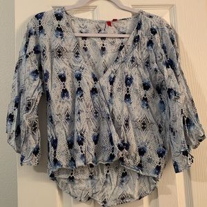 Flattering top w/ v-neck and bell sleeve.